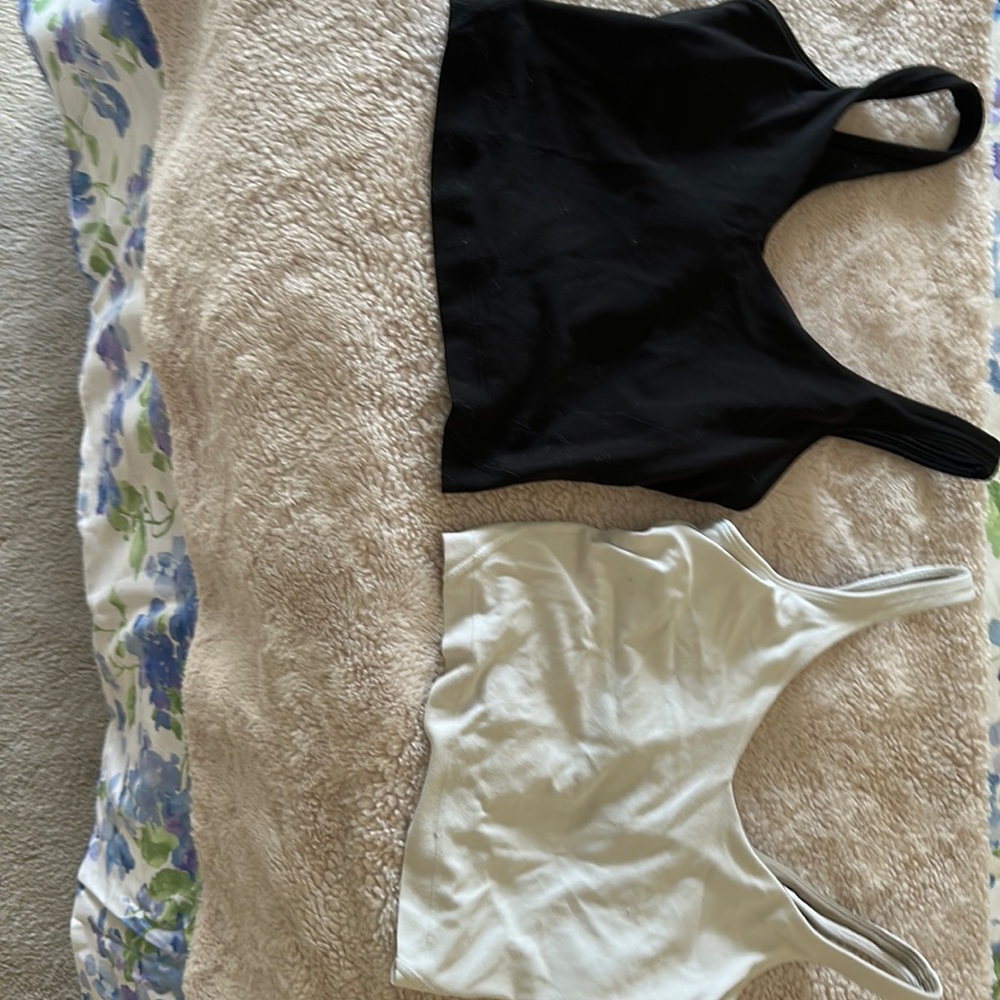 i’m selling two black and white Lululemon align tanks!!